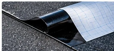 Illustrative peel-and-stick roofing membrane with release liner being removed